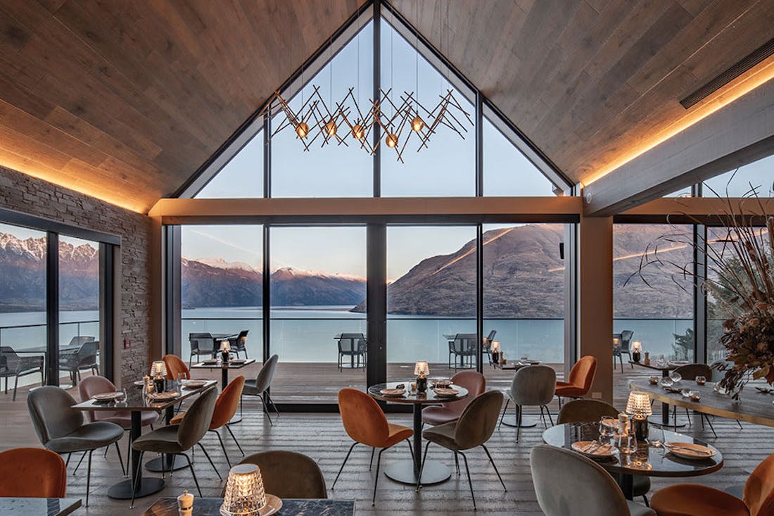 A restaurant overlooking turquoise water in NZ.